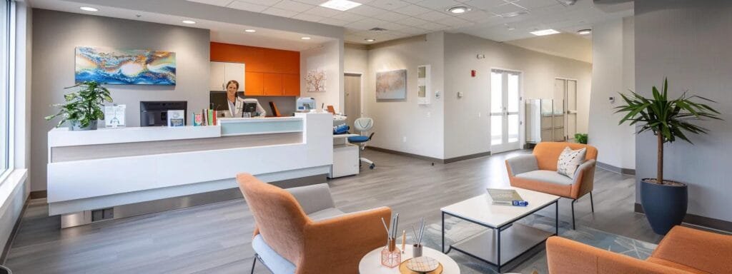 a modern medical office with a bright, clean aesthetic features a thoughtful healthcare professional reviewing a patient consultation folder on hormone replacement therapy, emphasizing a warm, informative atmosphere.